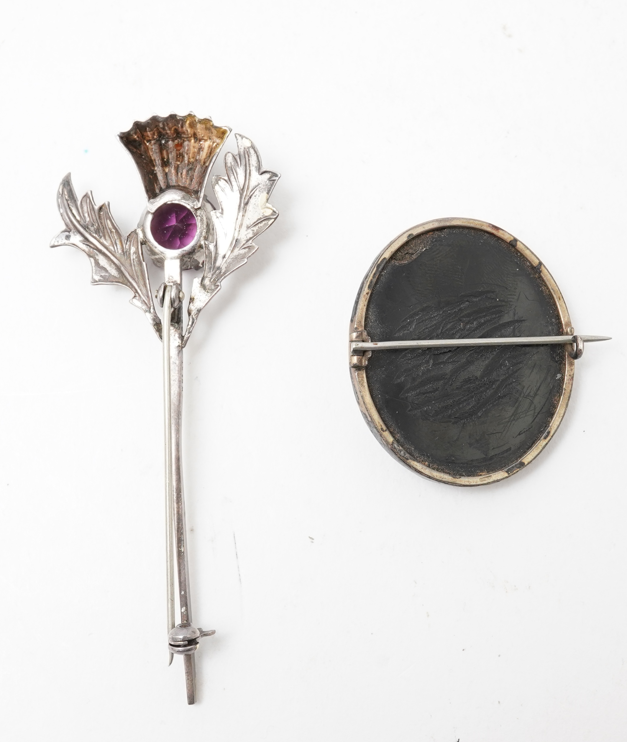 A collection of jewels including an Art Deco silver cigarette case